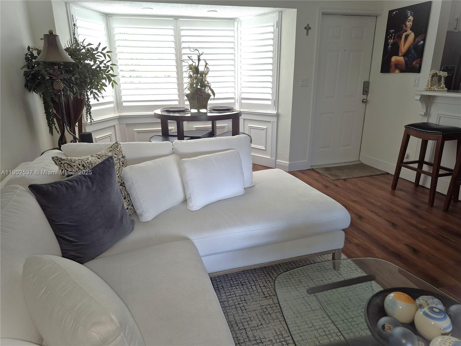 535 Hendricks Isle, Unit 306 Fort Lauderdale, FL 33301 - Photo 5 of 32 a living room with furniture and a large window