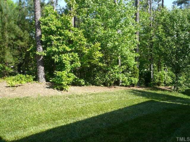 8008 Strawberry Meadows Street Raleigh, NC 27613 - Photo 12 of 12 Beautiful backyard with mature trees for extra privacy and a nice view. Perfect place for the kids and pets to play!