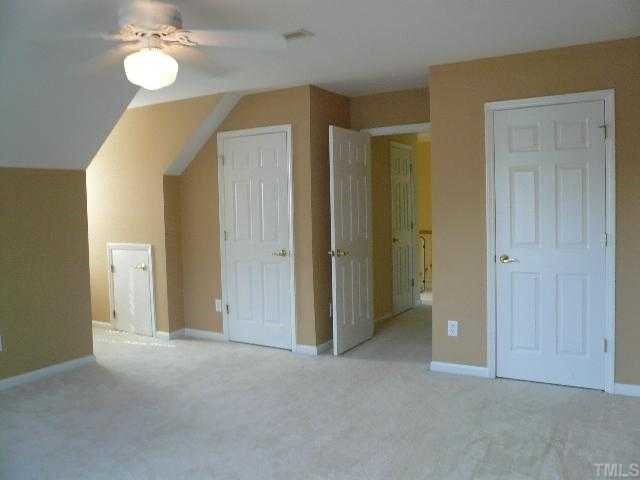 8008 Strawberry Meadows Street Raleigh, NC 27613 - Photo 10 of 12 The bonus room is huge with two closets, loads of eave storage, fresh paint and a ceiling fan. This would make a great home office or 4th bedroom.