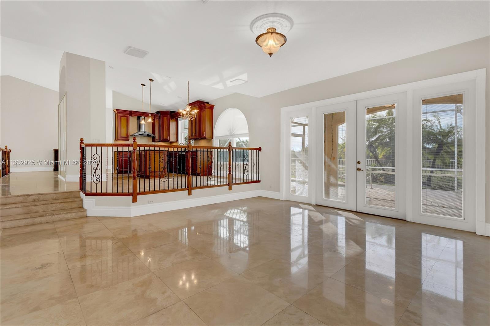 19610 Dinner Key Drive Boca Raton, FL 33498 - Photo 12 of 27 a view of a hallway with wooden floor and windows