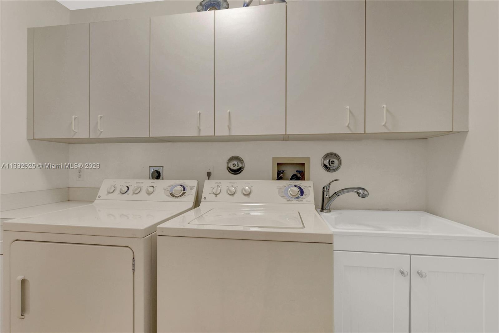 19610 Dinner Key Drive Boca Raton, FL 33498 - Photo 15 of 27 a utility room with dryer and washer