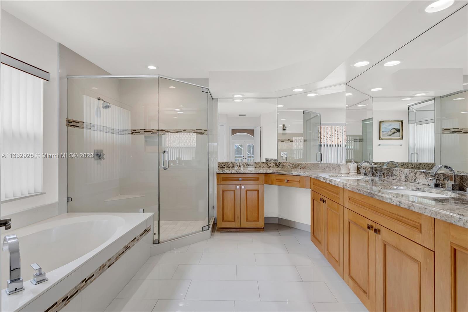 19610 Dinner Key Drive Boca Raton, FL 33498 - Photo 19 of 27 a large kitchen with a large tub sink and cabinets