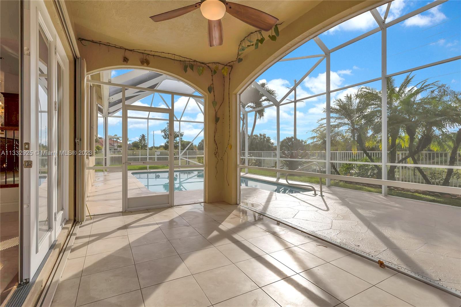 19610 Dinner Key Drive Boca Raton, FL 33498 - Photo 23 of 27 a view of a house with a swimming pool