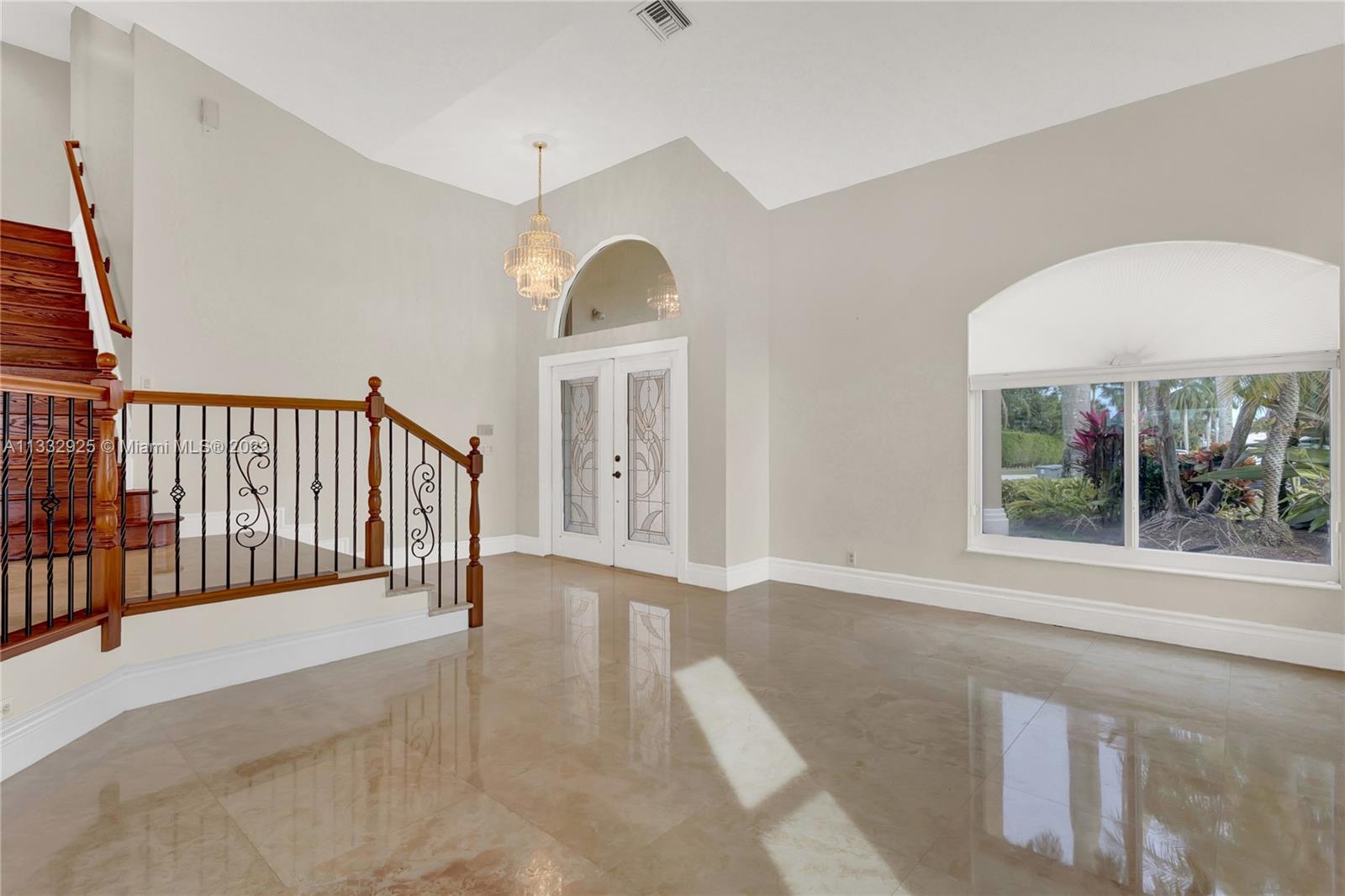 19610 Dinner Key Drive Boca Raton, FL 33498 - Photo 4 of 27 a view of a hallway with a porch