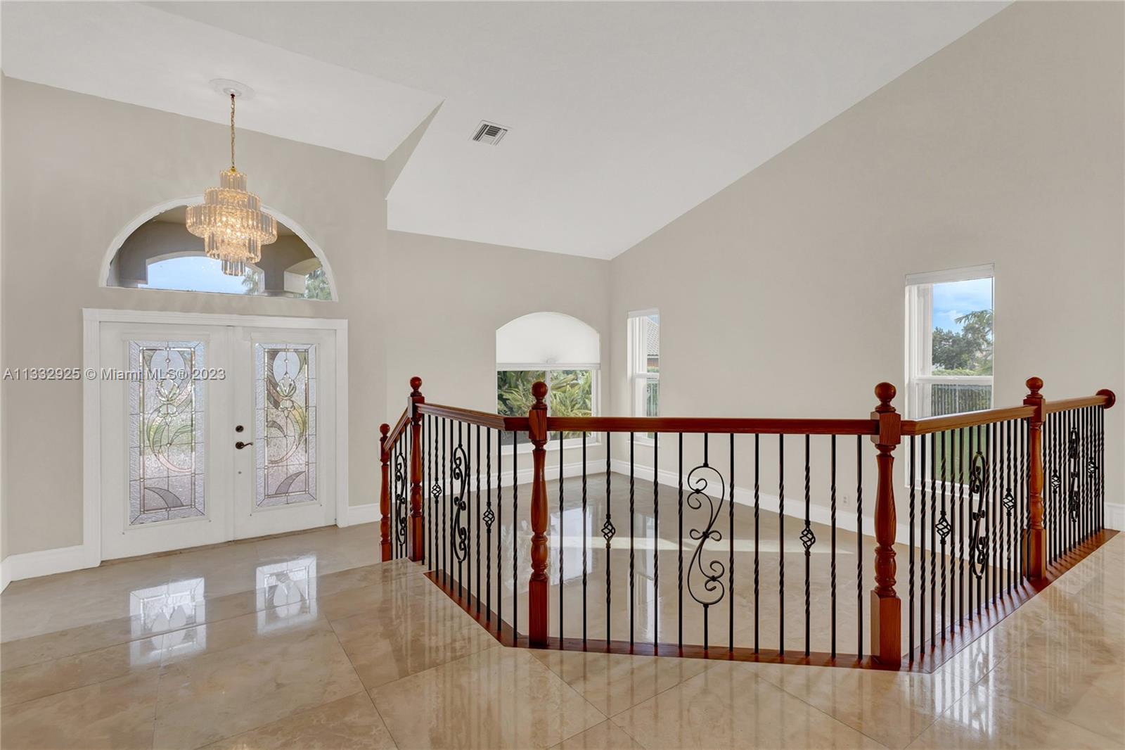 19610 Dinner Key Drive Boca Raton, FL 33498 - Photo 5 of 27 a view of entryway with wooden floor