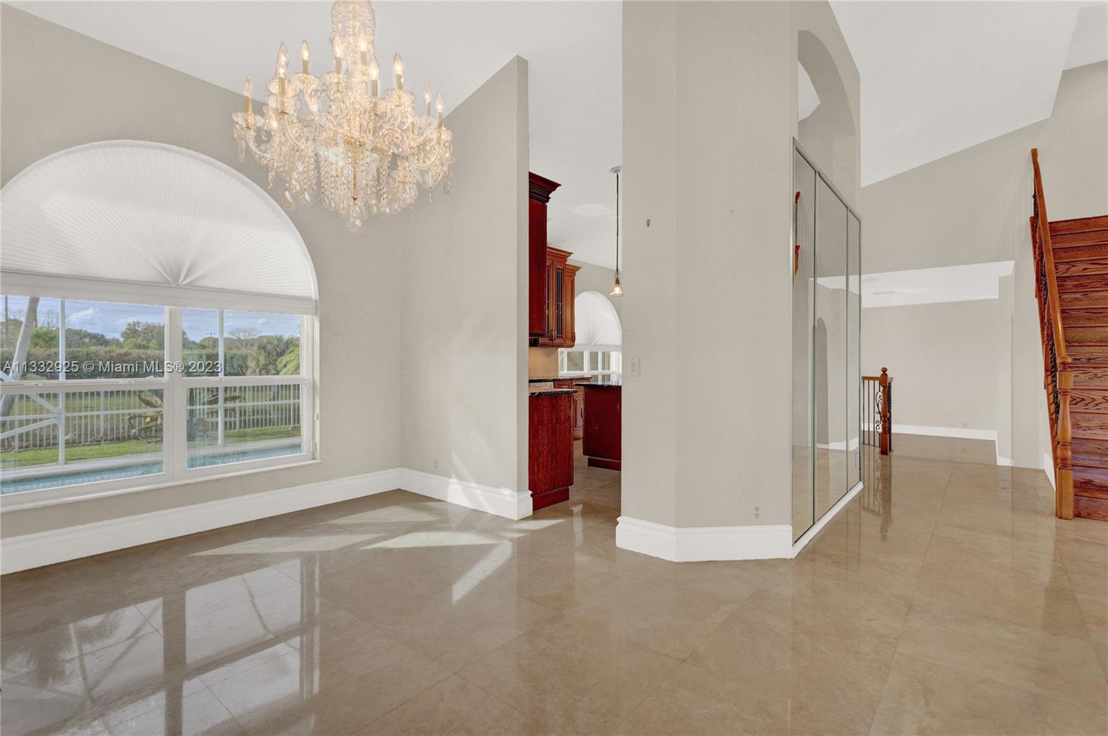 19610 Dinner Key Drive Boca Raton, FL 33498 - Photo 6 of 27 en empty room with windows and ceiling fan