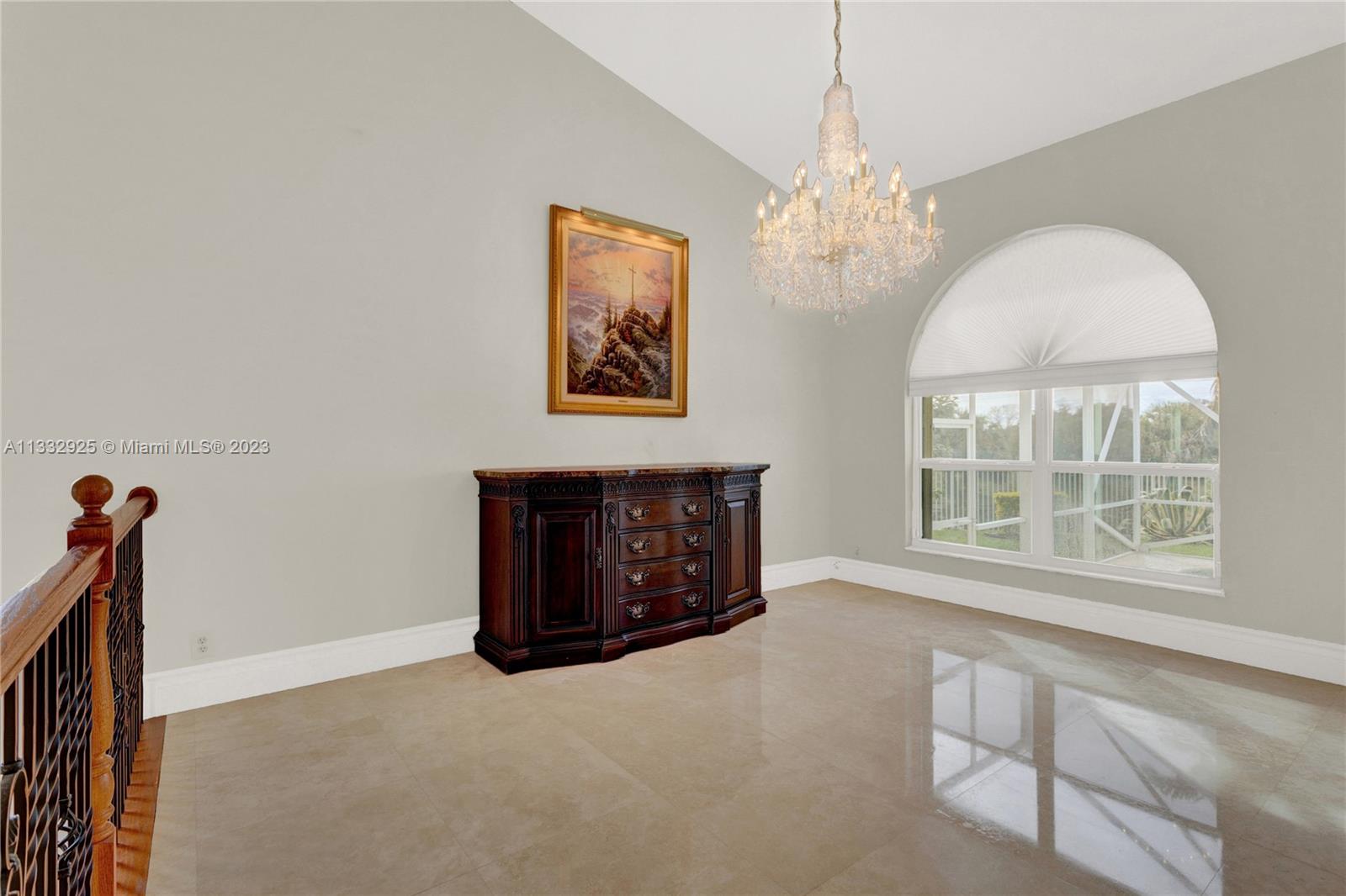 19610 Dinner Key Drive Boca Raton, FL 33498 - Photo 8 of 27 an empty room with windows and fan