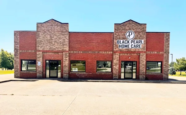 a view of a building with a sign on the wall