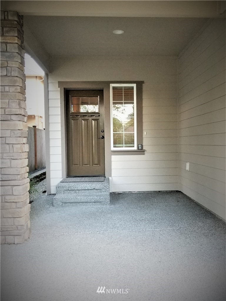 4818 155th Place Southwest, Unit 11 Edmonds, WA 98026 - Photo 2 of 30 a view of an empty room with closet and a window
