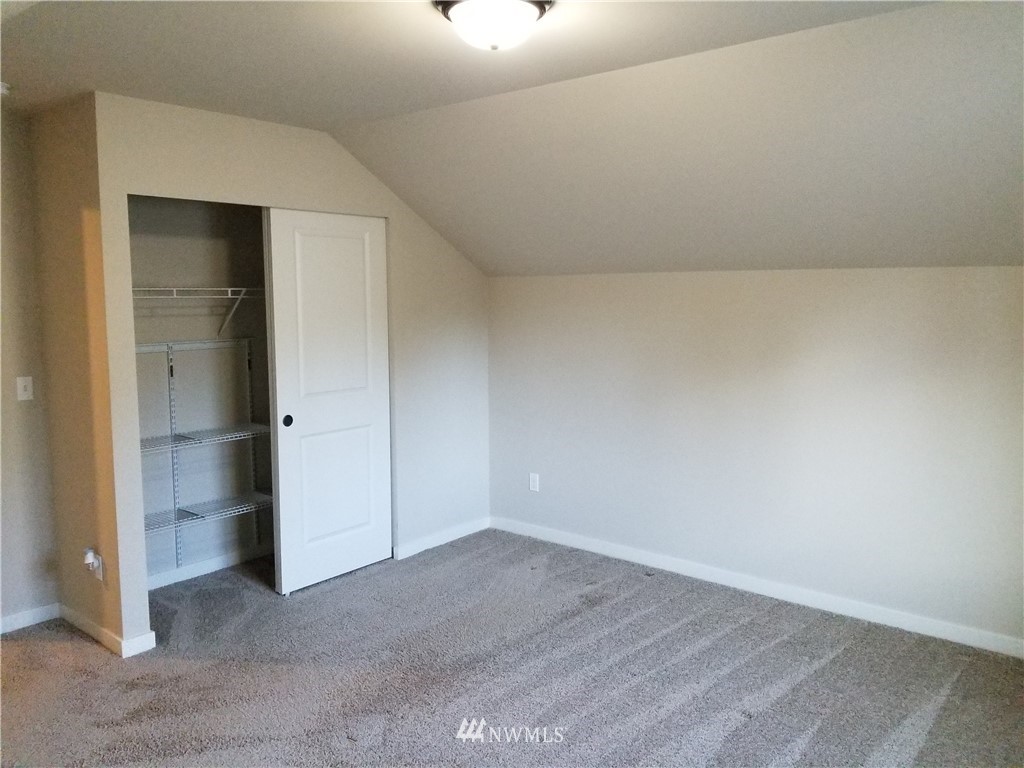 4818 155th Place Southwest, Unit 11 Edmonds, WA 98026 - Photo 16 of 30 an empty room with closet