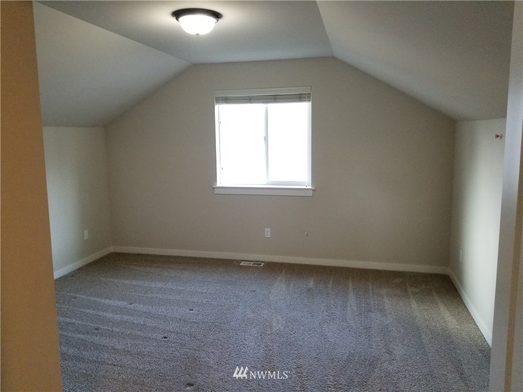 4818 155th Place Southwest, Unit 11 Edmonds, WA 98026 - Photo 18 of 30 an empty room with a window