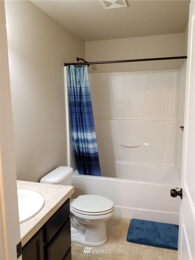 4818 155th Place Southwest, Unit 11 Edmonds, WA 98026 - Photo 19 of 30 a bathroom with a sink a toilet and shower