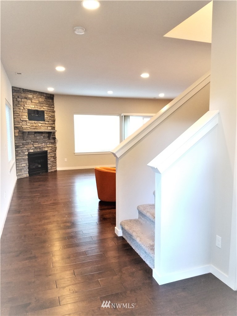 4818 155th Place Southwest, Unit 11 Edmonds, WA 98026 - Photo 3 of 30 a view of livingroom with hardwood floor and a ceiling fan