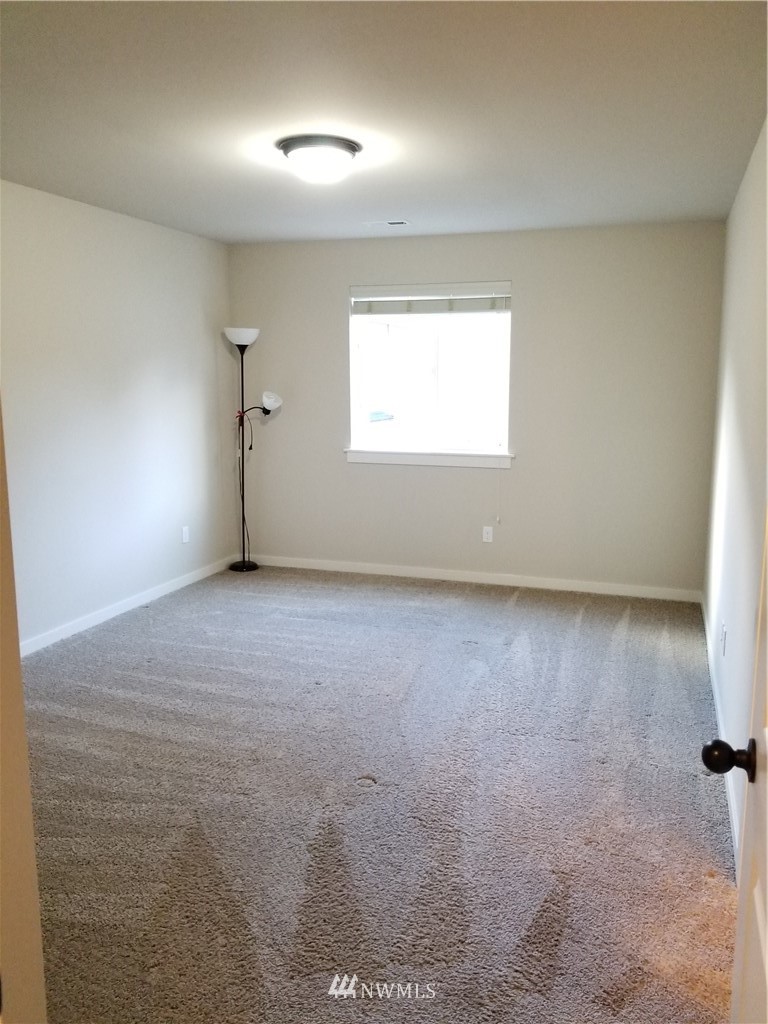 4818 155th Place Southwest, Unit 11 Edmonds, WA 98026 - Photo 21 of 30 an empty room with a window