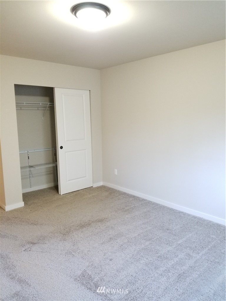 4818 155th Place Southwest, Unit 11 Edmonds, WA 98026 - Photo 22 of 30 an empty room with an entryway