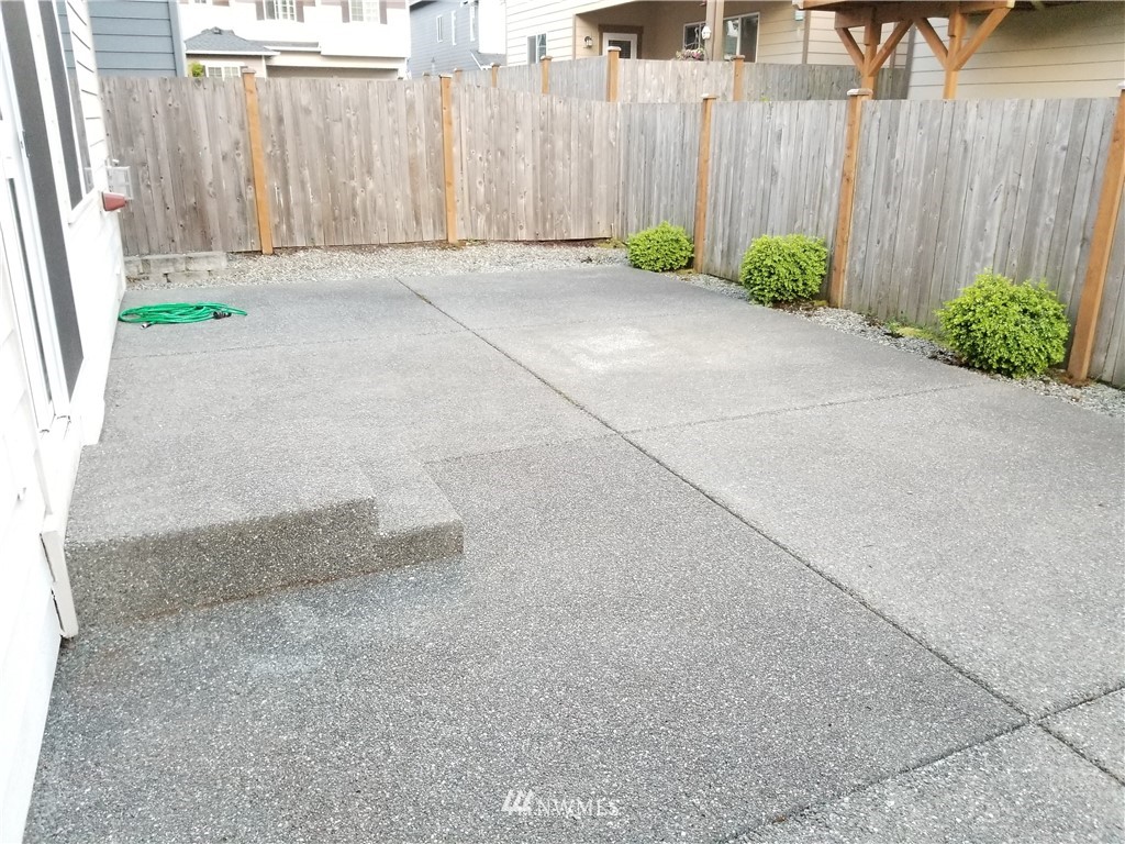 4818 155th Place Southwest, Unit 11 Edmonds, WA 98026 - Photo 29 of 30 a view of backyard with tub and plants