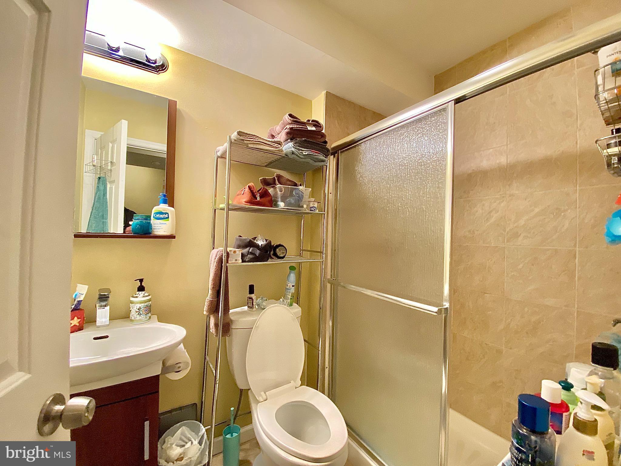 1618 Page Street, Unit A Philadelphia, PA 19121 - Photo 11 of 17 a bathroom with a sink toilet and shower
