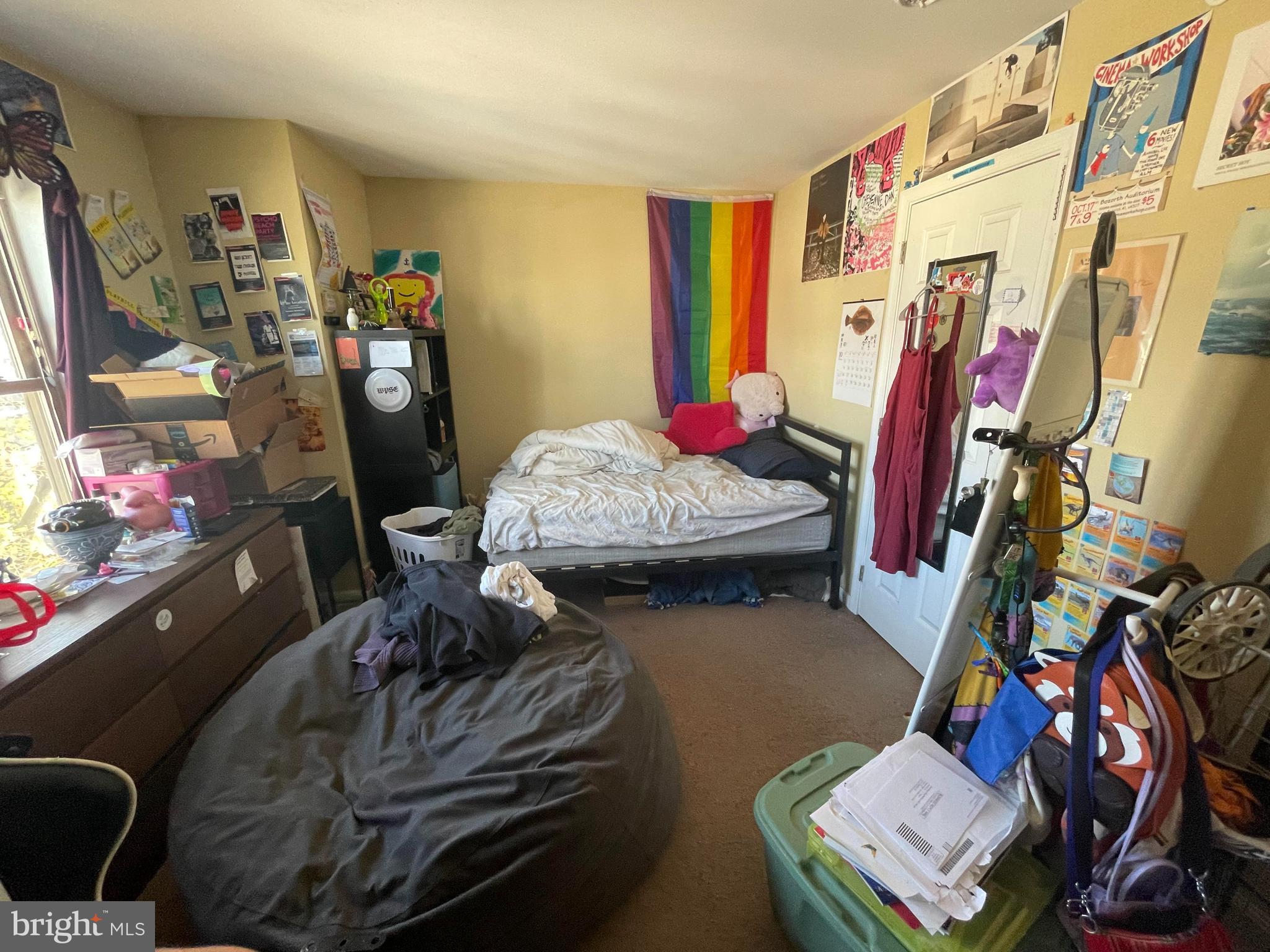 1618 Page Street, Unit A Philadelphia, PA 19121 - Photo 15 of 17 a living room with furniture a rug and gym equipment