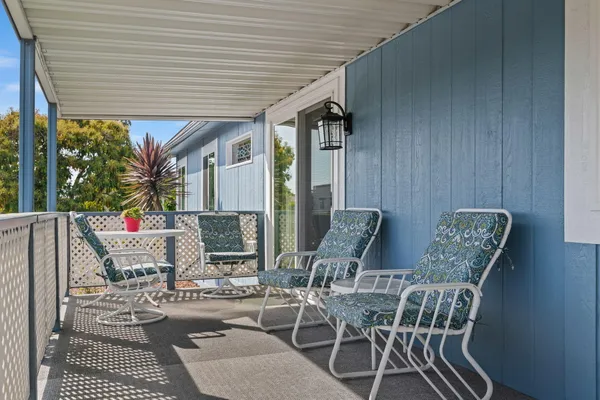 a view of an outdoor space with furniture