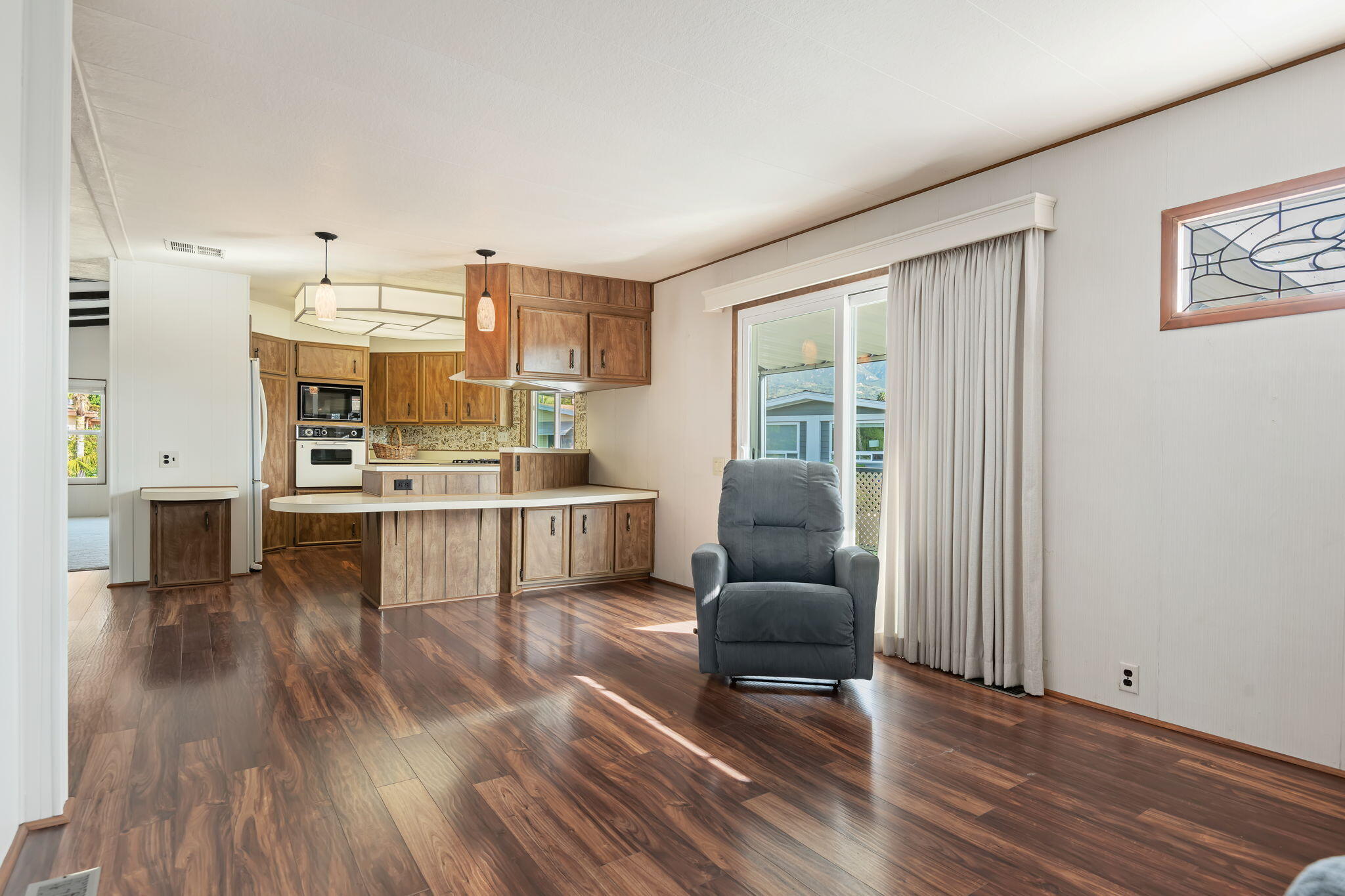 340 Old Mill Road, Unit 186 Santa Barbara, CA 93110 - Photo 18 of 40 a living room with furniture and a wooden floor