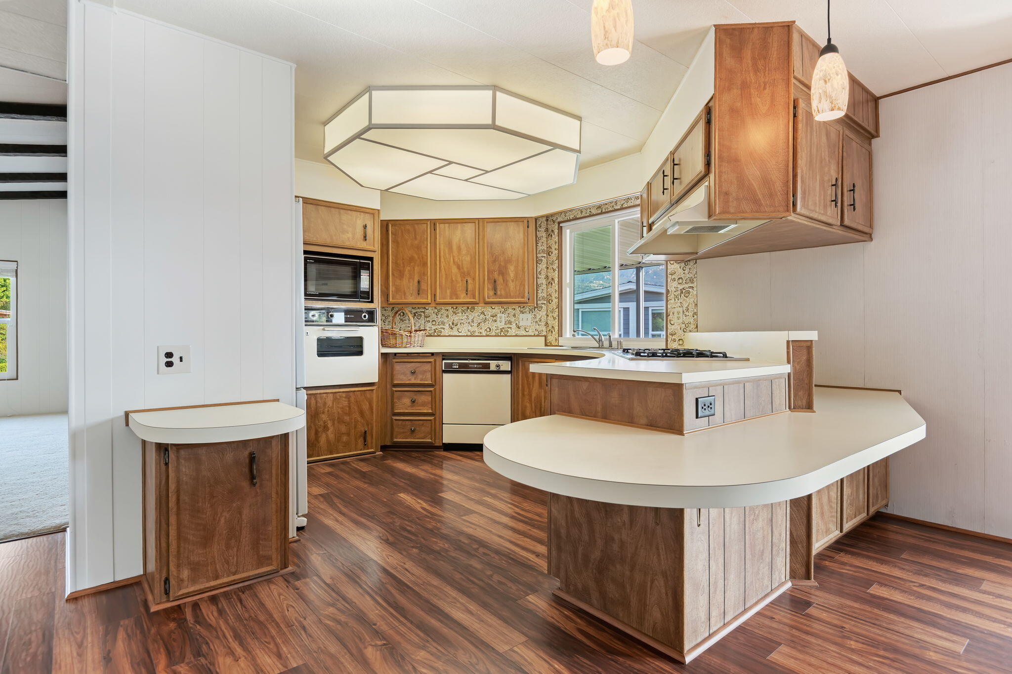 340 Old Mill Road, Unit 186 Santa Barbara, CA 93110 - Photo 19 of 40 a kitchen with stainless steel appliances a white wooden cabinets and stove top oven