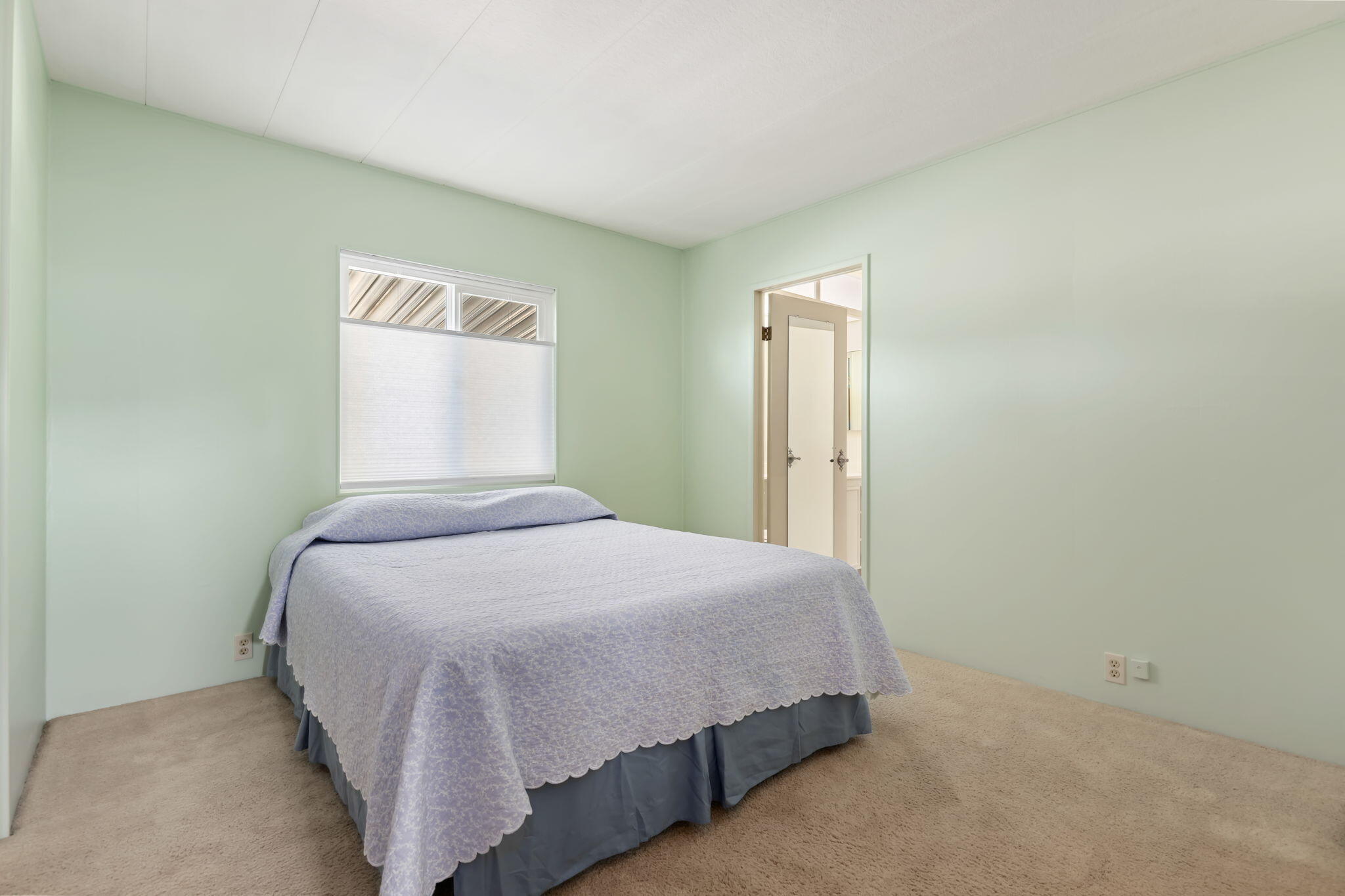 340 Old Mill Road, Unit 186 Santa Barbara, CA 93110 - Photo 25 of 40 a bedroom with a bed and a wall painting