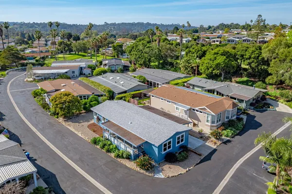 an aerial view of a house with a garden