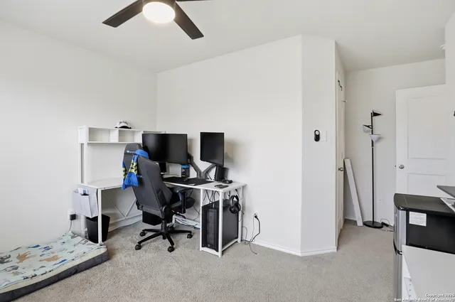 a view of a workspace with furniture