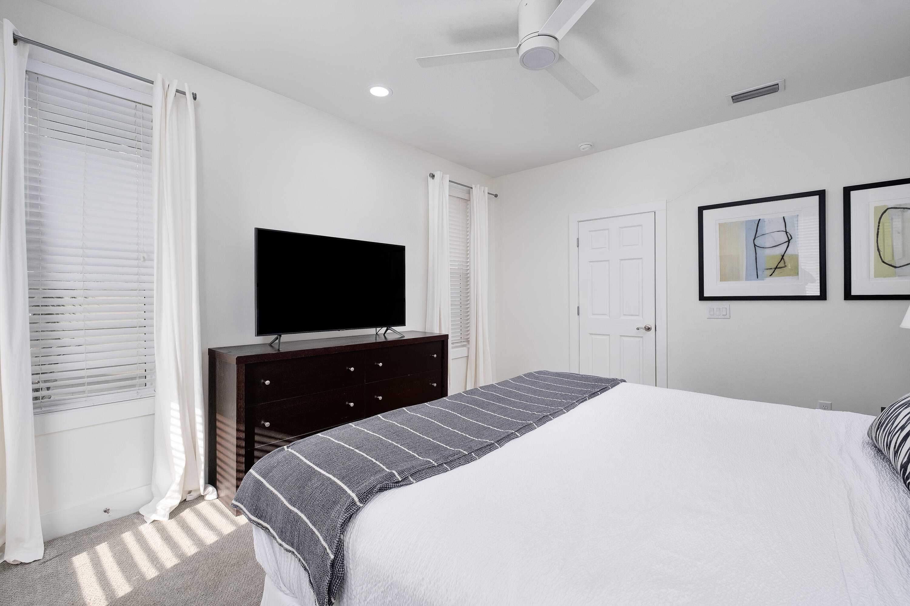 190 Seacrest Beach Boulevard West Seacrest, FL 32461 - Photo 17 of 37 a bedroom with a bed and a flat screen tv