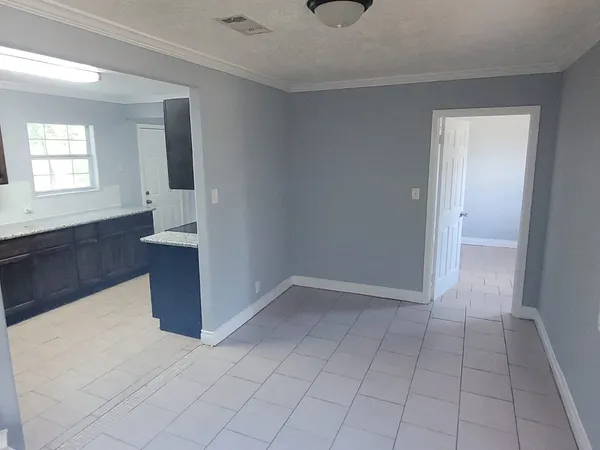 a view of an empty room and window