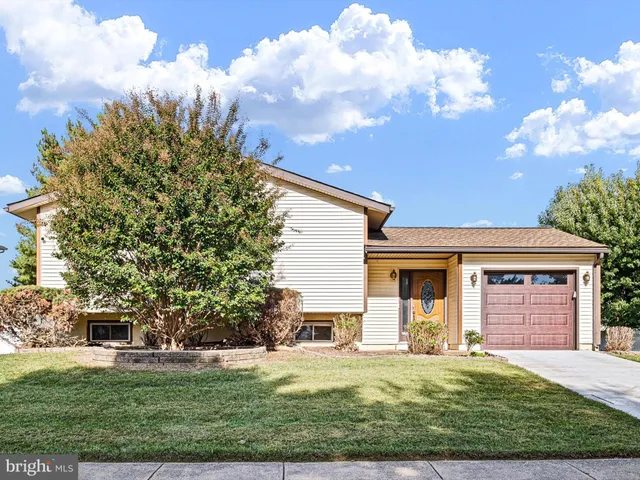 front view of a house with yard