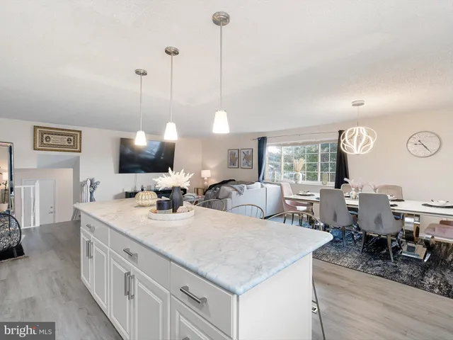 a view of living room with granite countertop furniture and fireplace