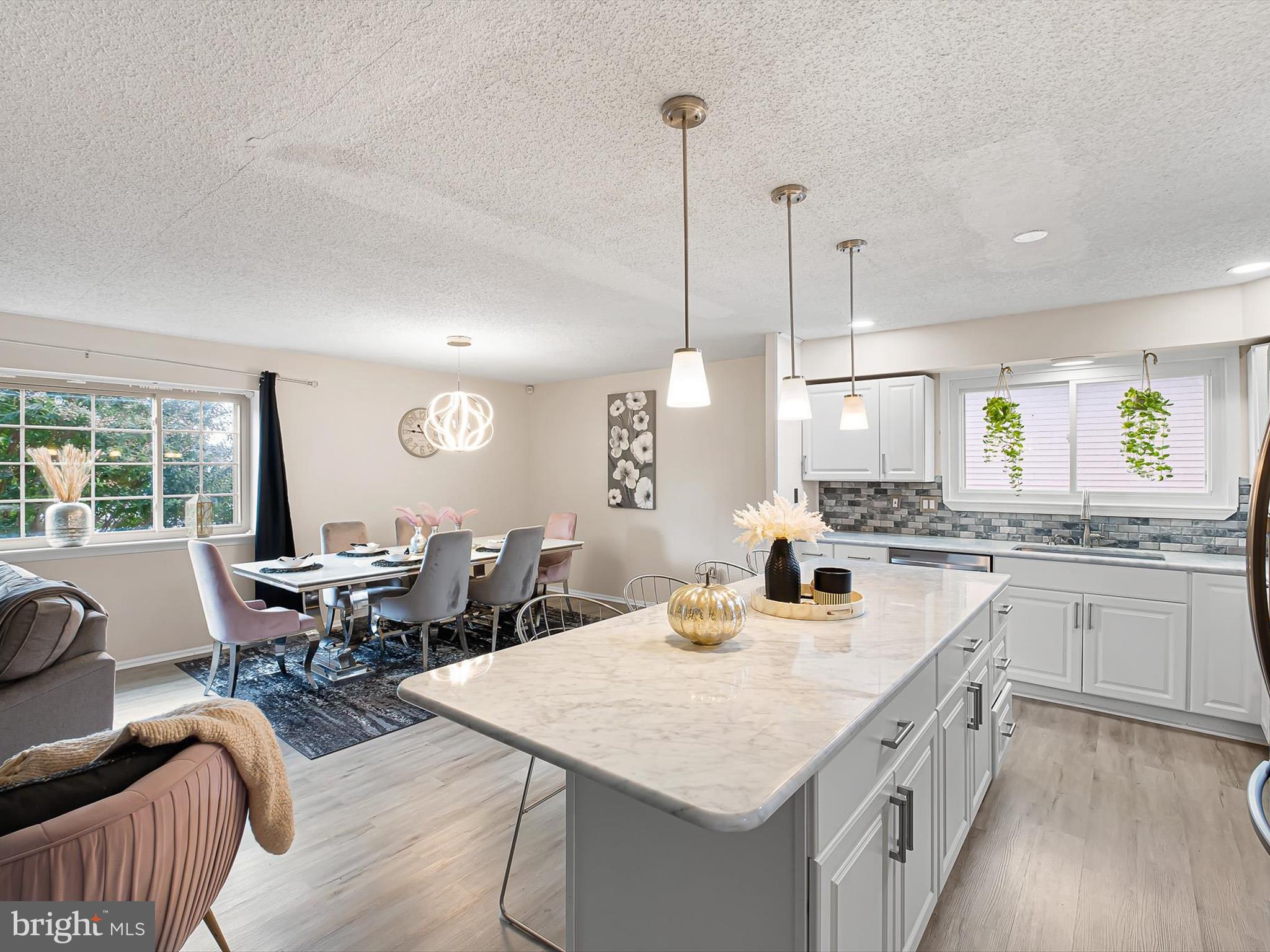 74 Valley Forge Road New Castle, DE 19720 - Photo 17 of 30 a kitchen with a table chairs stove and granite counter tops