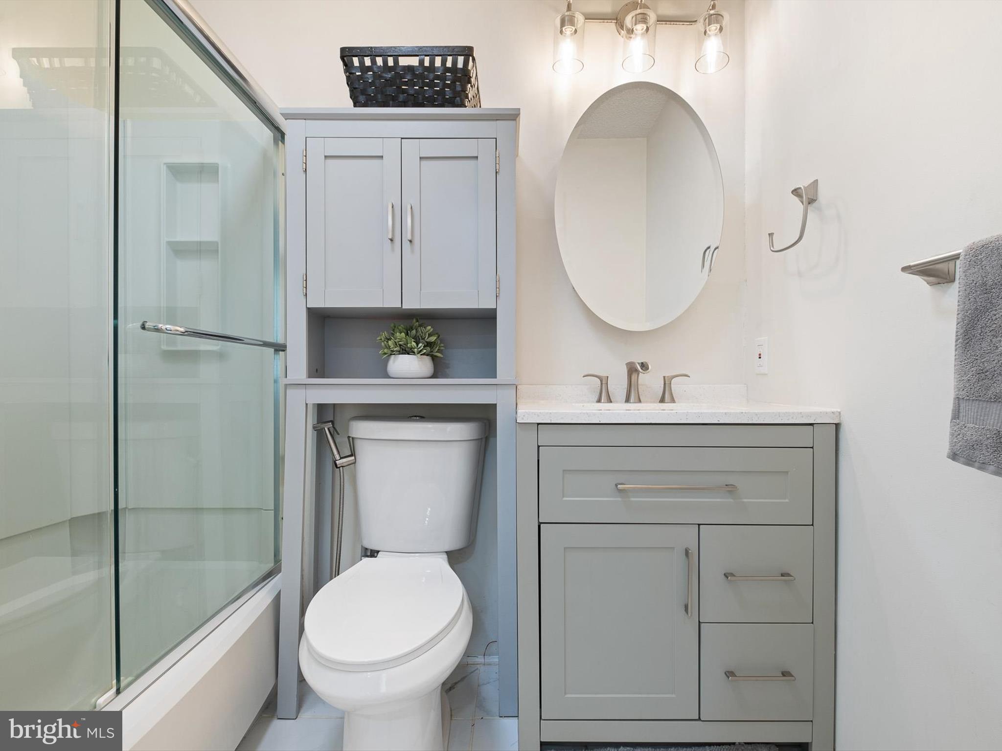 74 Valley Forge Road New Castle, DE 19720 - Photo 20 of 30 a bathroom with a toilet a sink a mirror and vanity