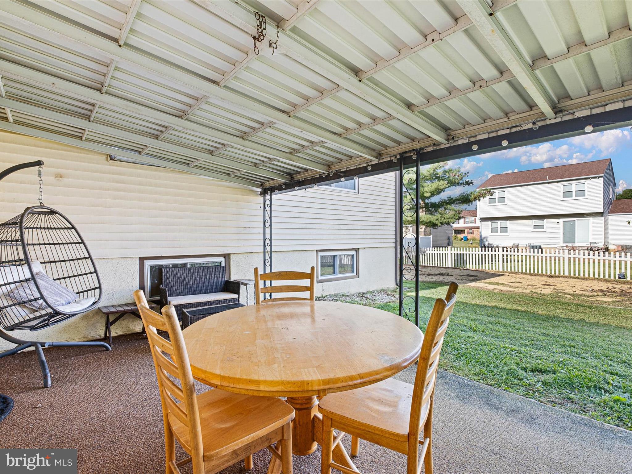 74 Valley Forge Road New Castle, DE 19720 - Photo 5 of 30 a patio with a table and chairs