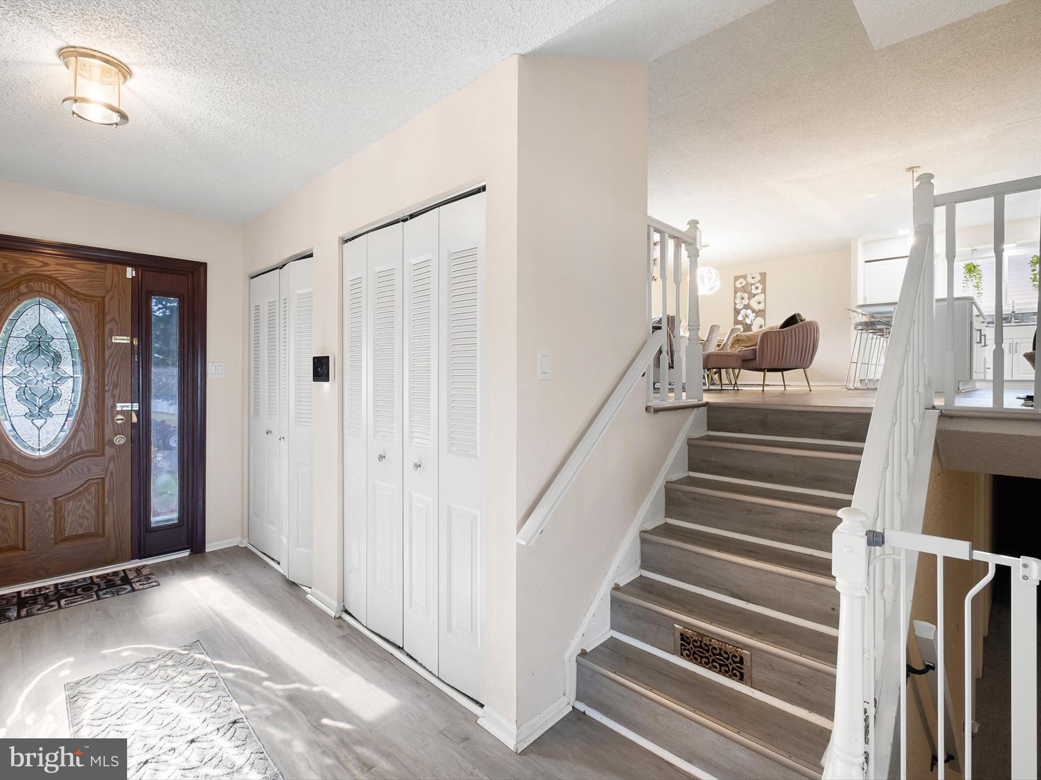 74 Valley Forge Road New Castle, DE 19720 - Photo 7 of 30 a view of a hallway with entryway wooden floor and front door
