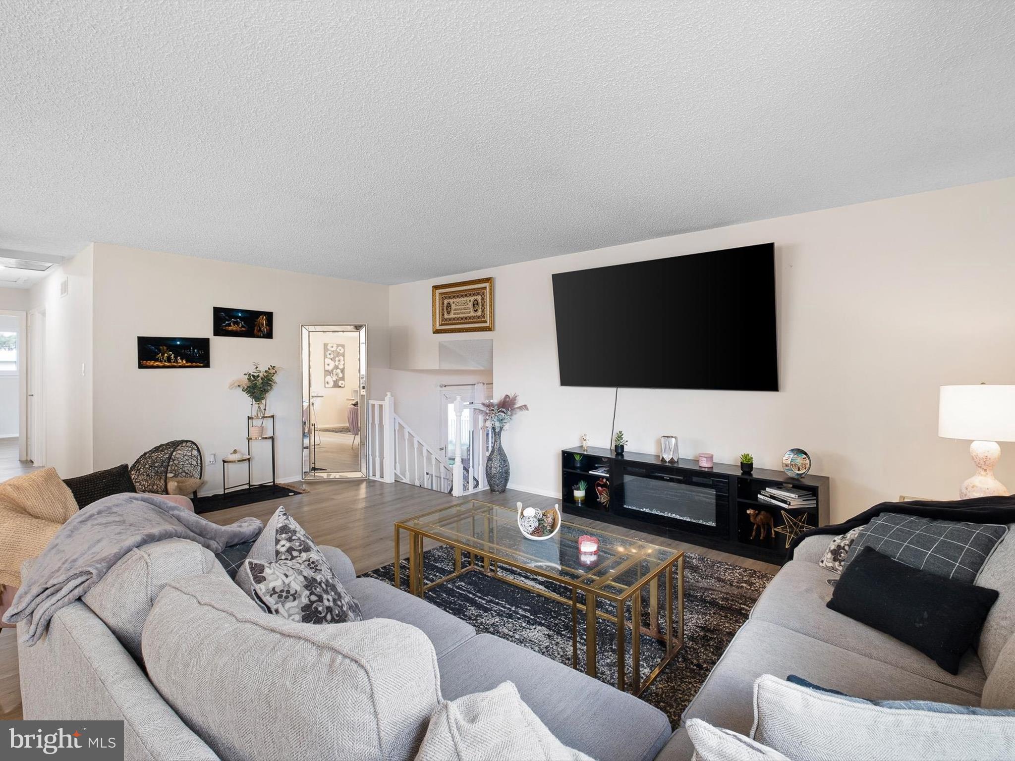 74 Valley Forge Road New Castle, DE 19720 - Photo 8 of 30 a living room with furniture and a flat screen tv