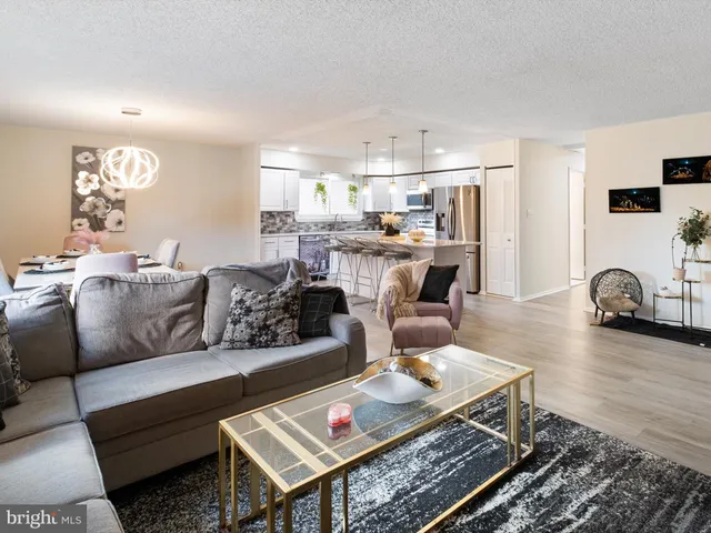 a living room with furniture and a table
