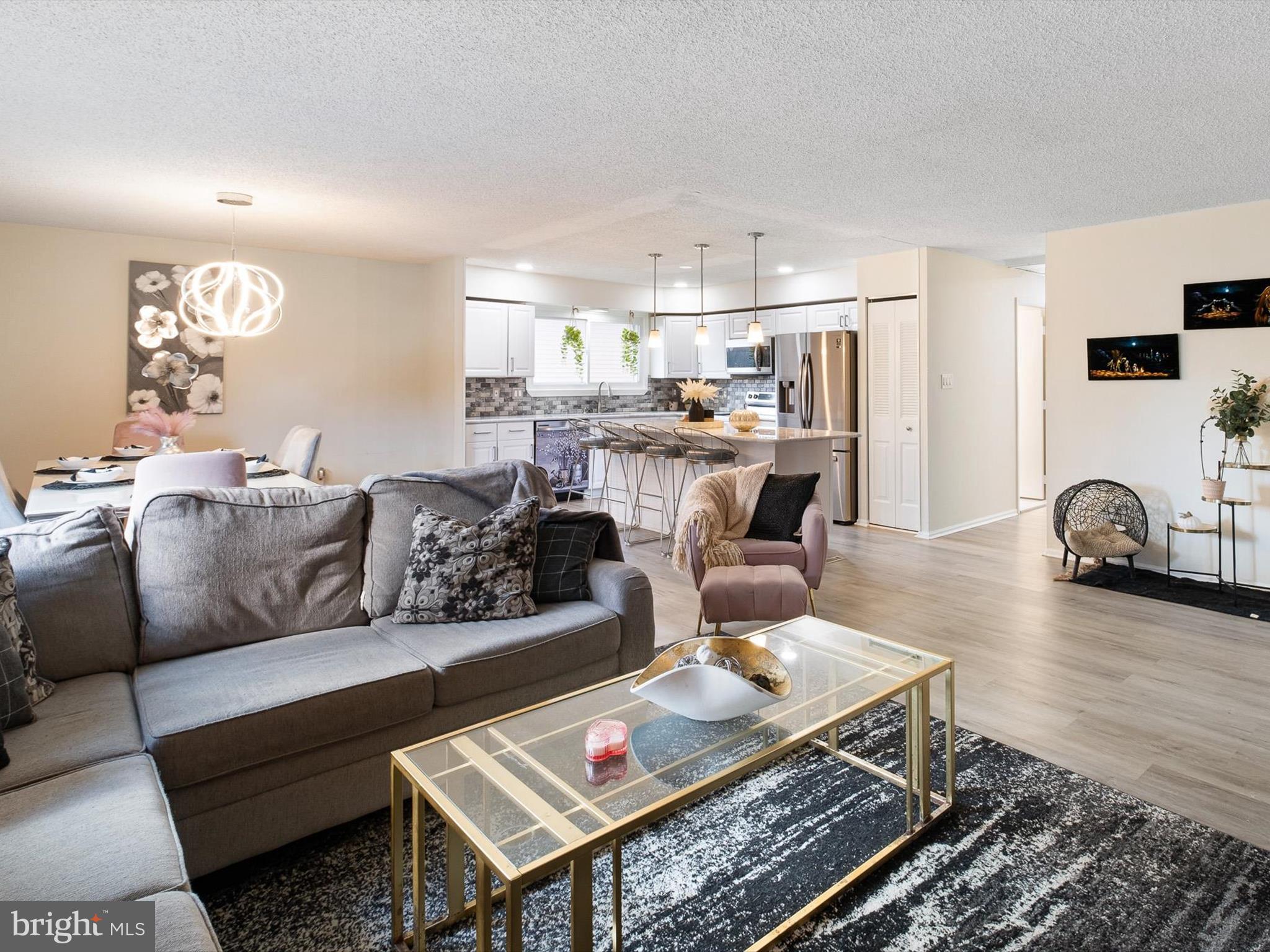 74 Valley Forge Road New Castle, DE 19720 - Photo 9 of 30 a living room with furniture and a table