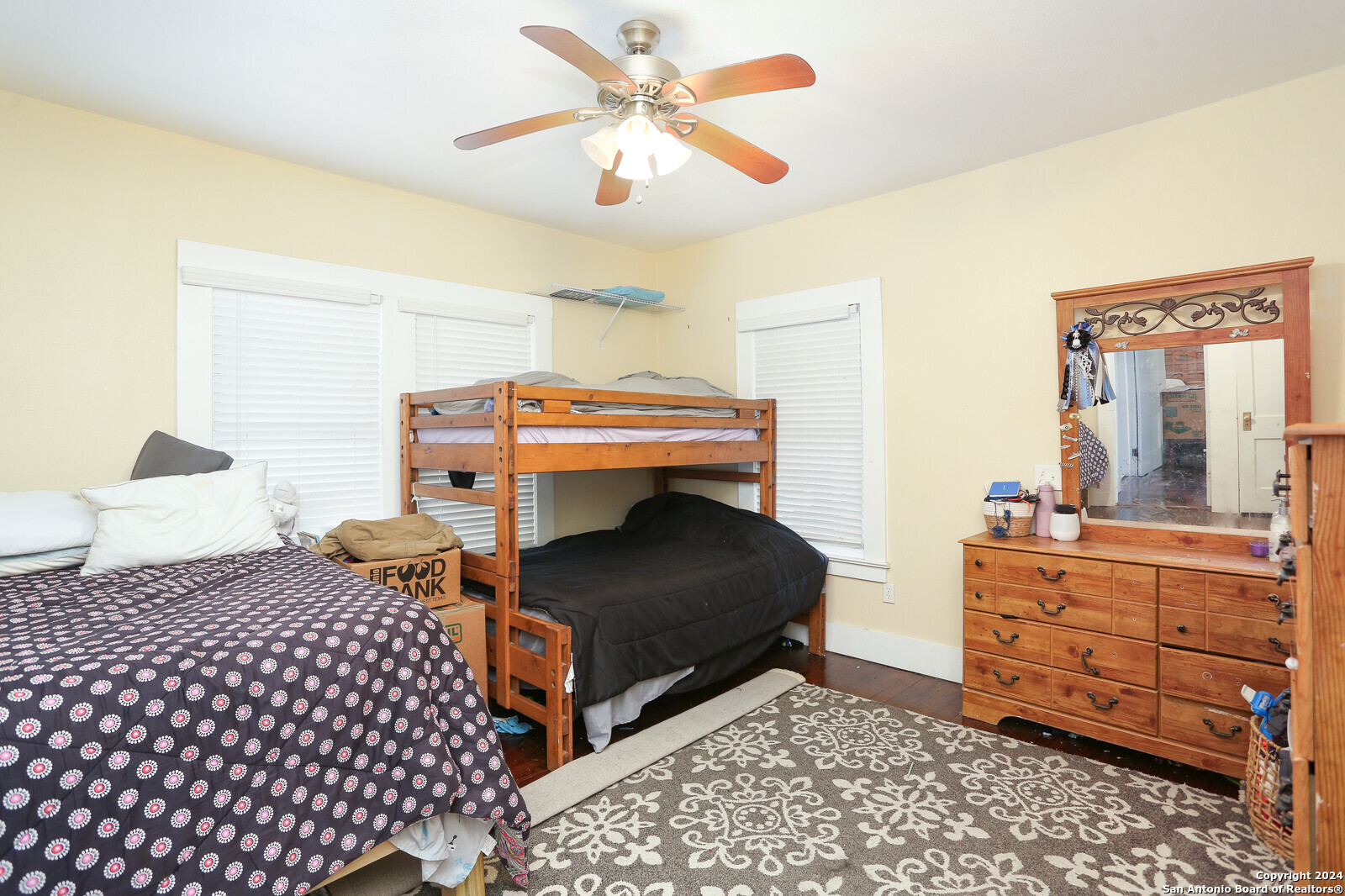 511 Devine Street San Antonio, TX 78210 - Photo 15 of 28 a bedroom with a bed and a dresser