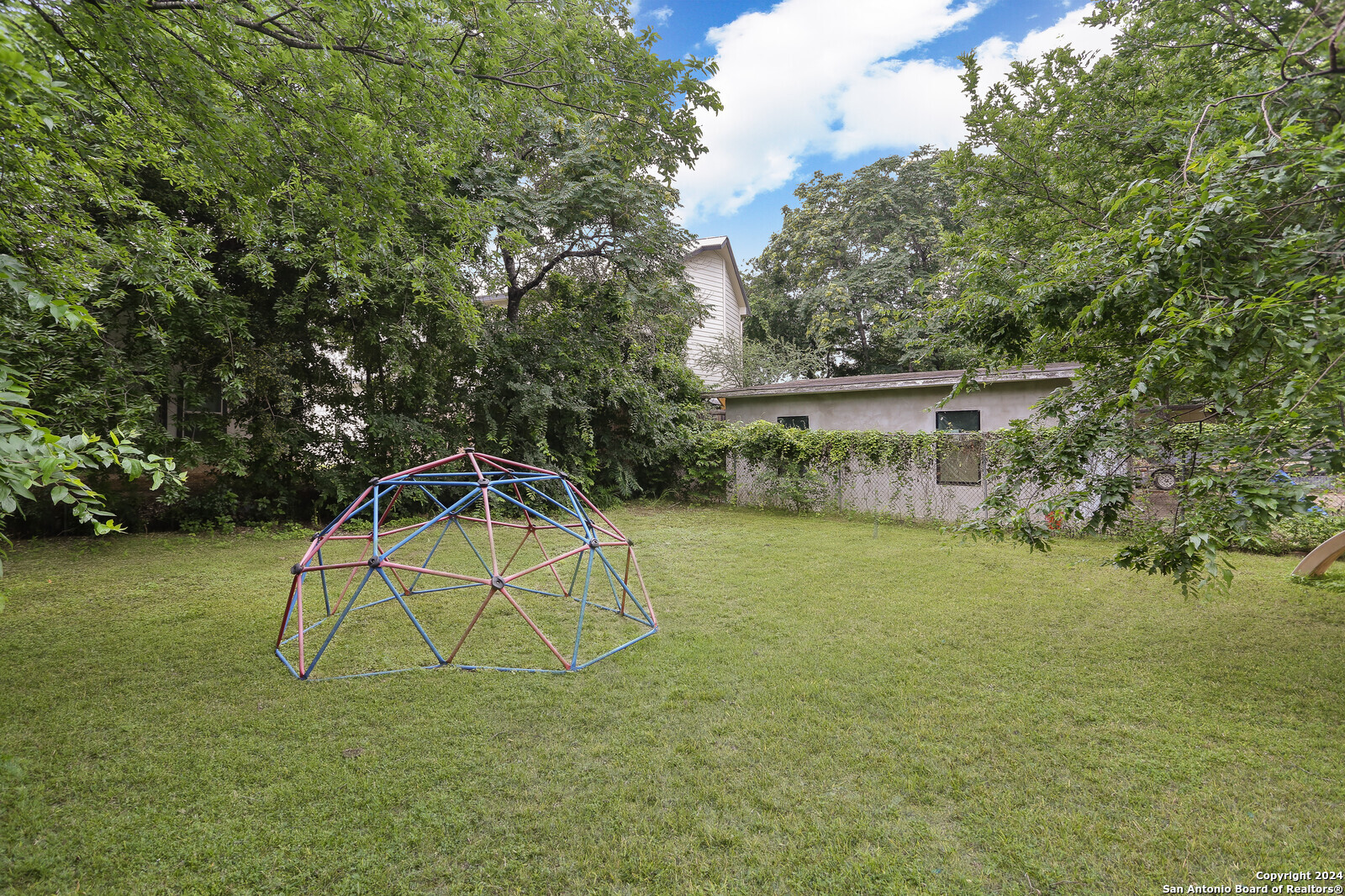 511 Devine Street San Antonio, TX 78210 - Photo 19 of 28 a view of a house with a yard