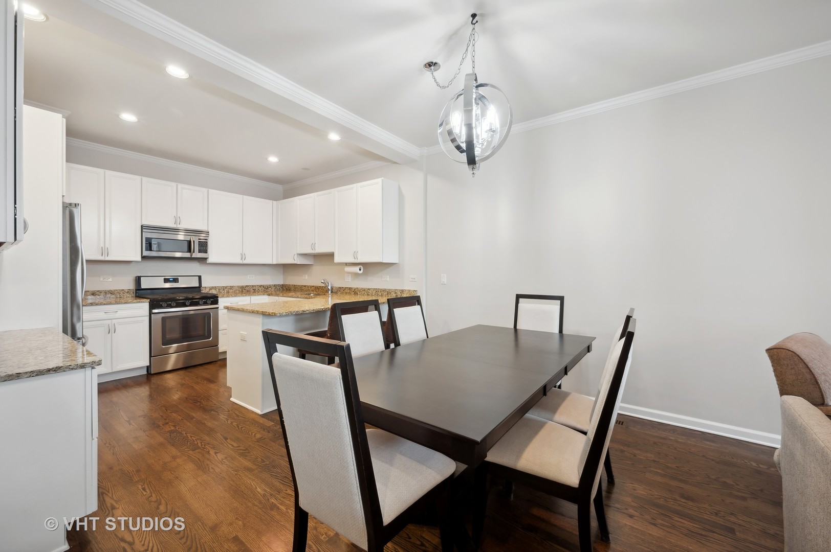 1508 North Sedgwick Street, Unit 5N Chicago, IL 60610 - Photo 4 of 20 a view of a dining room with furniture and wooden floor