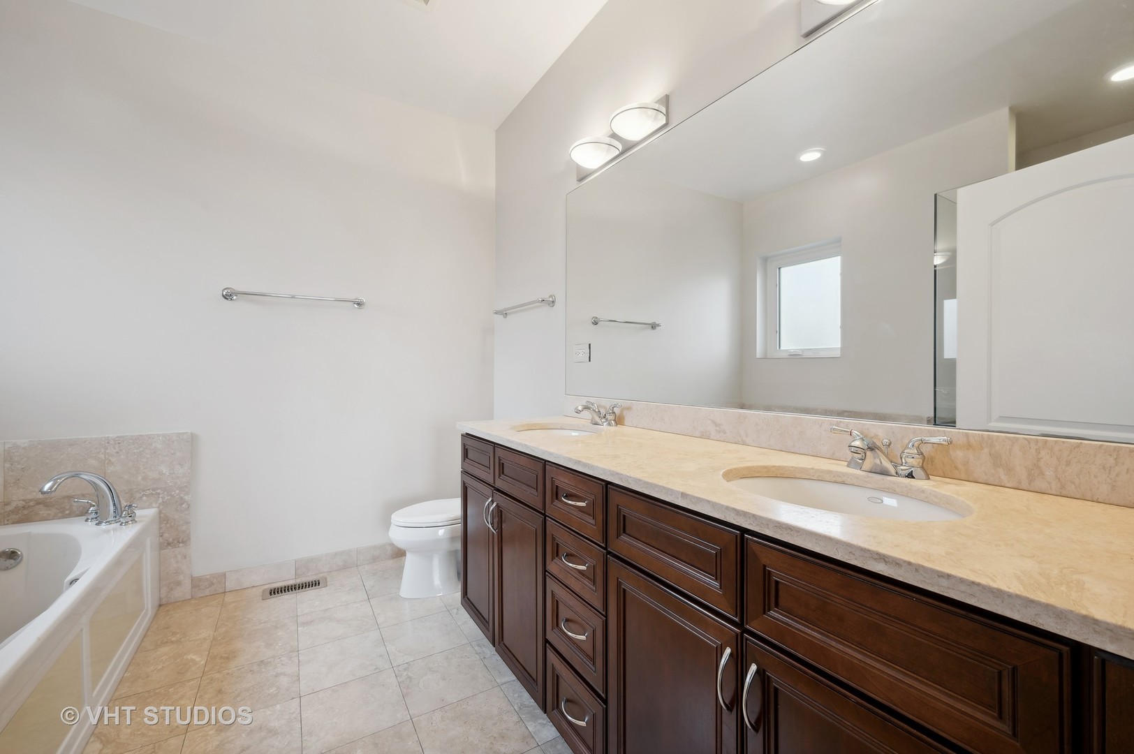 1508 North Sedgwick Street, Unit 5N Chicago, IL 60610 - Photo 10 of 20 a spacious bathroom with a granite countertop sink a toilet and bathtub