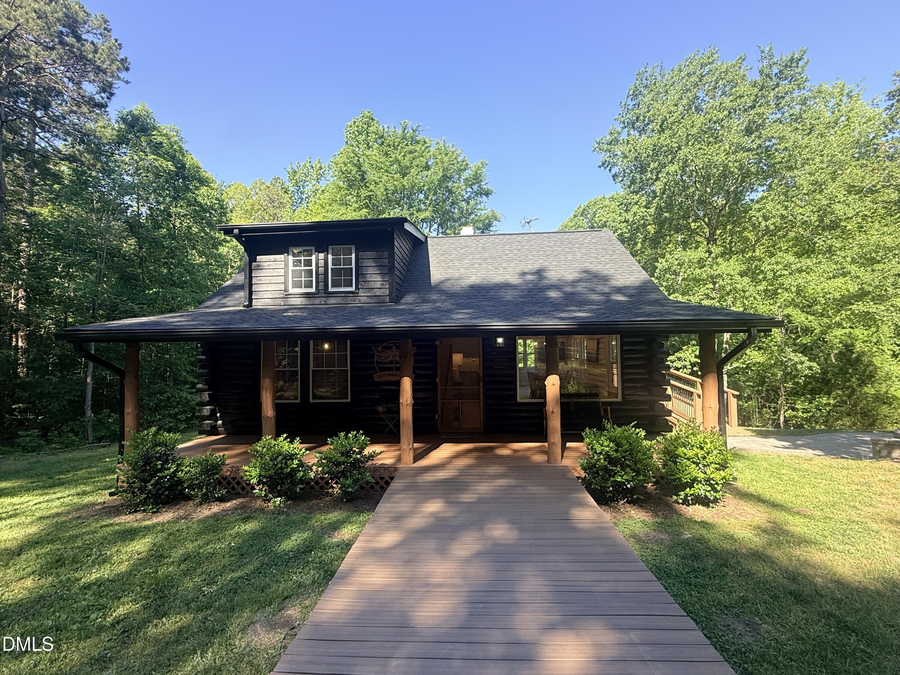 327 Shady Oak Road Roxboro, NC 27574 - Photo 59 of 62 a front view of house with a garden