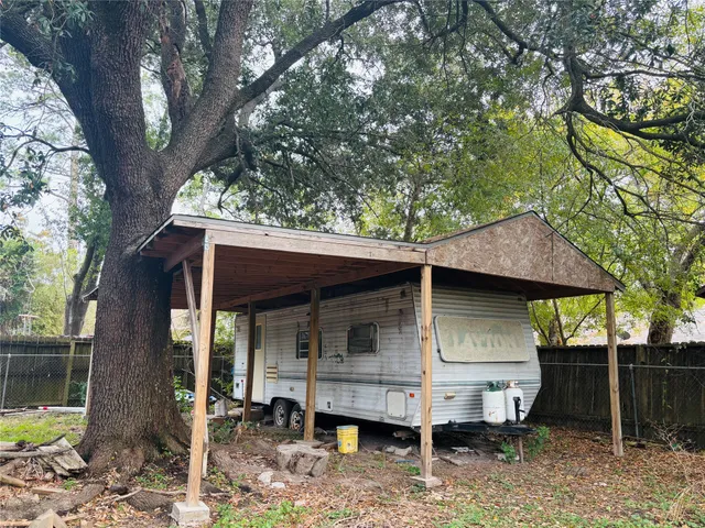 a house view with a backyard space
