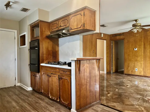 an entryway with wooden floor