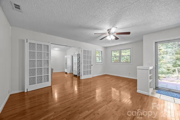 a living room with furniture a fireplace and a table