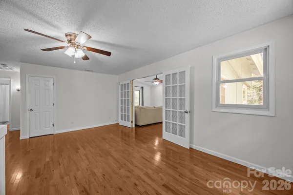 a kitchen with granite countertop stainless steel appliances a sink cabinets and a refrigerator