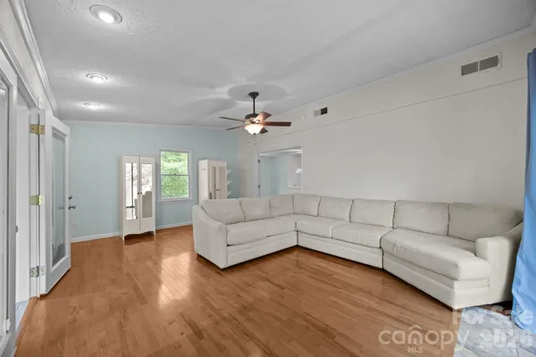 a view of an empty room and a window