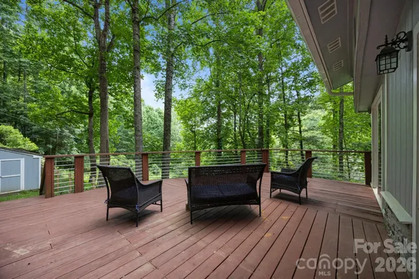 a view of a wooden bench sitting on roof deck